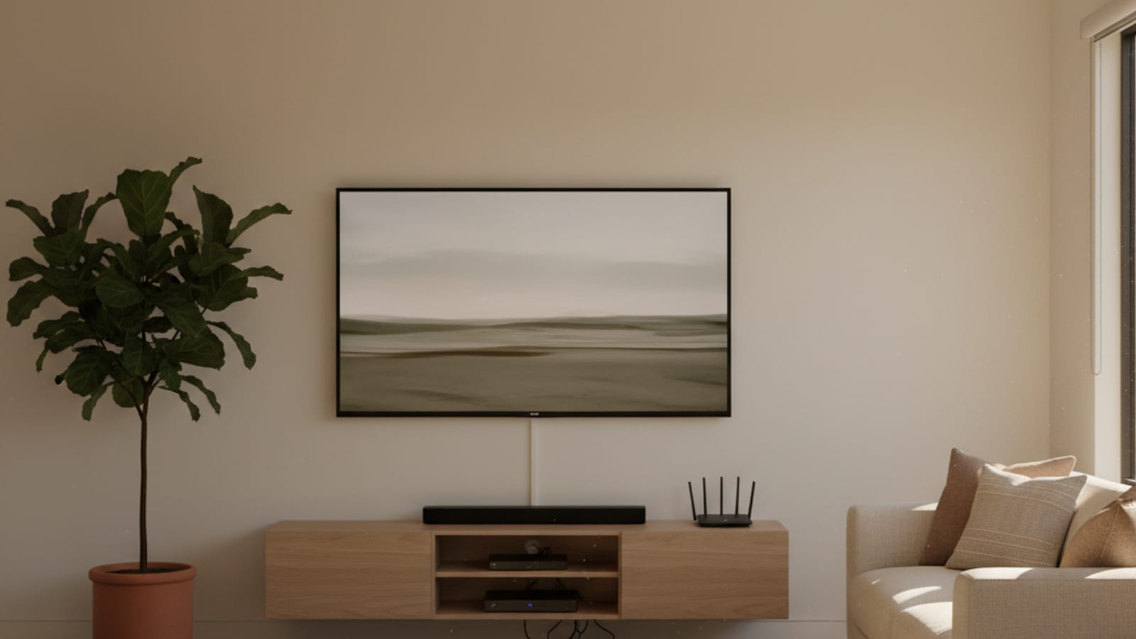 Large flat-screen TV mounted flush to a warm white living room wall in a San Diego home, cables hidden behind the wall, clean minimalist setup